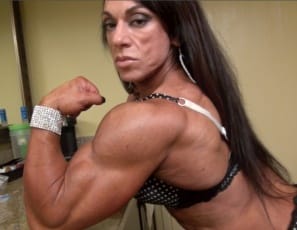 Tattooed female bodybuilder Carla shows that she's a professional, because she can pose in a kitchen and make it look hot, showing off her ripped abs, vascular biceps, muscular pecs, glutes, legs, and calves, and muscle control, all in sexy panties. 