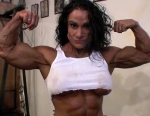 It's a day after professional bodybuilder Debbie Bramwell's show, she's looking hot and she wants you to watch her get pumped. She's working the spectacular Bramwell biceps, triceps and abs in this video - look for the incredible peaks as she poses and how she makes her triceps dance. 