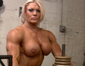 A very ripped and vascular Lisa Cross works on her bodybuilding poses in the gym, and while she’s getting naked you’ll enjoy looking at her perfect pecs and abs, and at her huge biceps, legs and calves. She’s big all over, as you’ll see when you get a glimpse of her pretty kitty as she does a nude leg press.