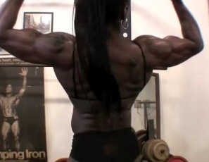 Bodybuilder Roxanne Edwards pumps up her ebony biceps on video in the SheMuscle gym, showing off her jaw-dropping abs, then poses so you can enjoy every massive inch of her muscular arms and legs. Think she’s intense? That’s what made her look like this. 