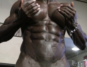 In the gym, bodybuilder Roxanne Edwards  takes off the panties that say “Yes Please” and poses naked to show off the incredible vascularity popping out of her oiled ebony skin. Her pecs, legs, glutes, calves, biceps and abs ripple and glow. It’s enough to make you say “Yes, please.”
