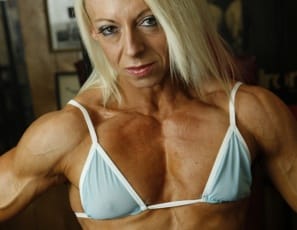 Professional female bodybuilder Nathalie Falk has a perfect six-pack. It's not the kind you drink from – it's made of muscular, ripped, vascular, tattooed abs, and when she's posing in the gym in nothing but panties, you can't stop looking at it. Her pecs, legs, glutes, calves and biceps are pretty perfect, too.