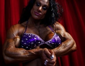 Competitive bodybuilder Debbie Bramwell does a private posing session for you. She's in competition shape, so you can see her spectacular biceps, triceps and lats; her dangerous abs; her outstanding vascularity - you're going to want to see every magnificently muscled inch. Which is why she's wearing #1. 