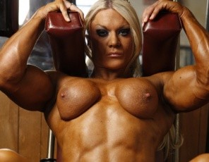 Bodybuilder Lisa Cross looks even bigger in pink as she poses in the gym – look at her huge biceps, bulging pecs and ripped, vascular abs. Her glutes and legs look great, too – must be those reverse hack squats. And don’t miss the close-up of her lovely pussy and big clit – now that’s really big pink!
