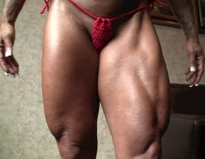 Female bodybuilder Monica Martin gives you a virtual session, posing to show you her big, vascular biceps, legs and calves, her gorgeous glutes in tiny panties, her tattooed, ripped abs, and her muscle control of her powerful pecs. I'm your muscle fantasy, she says, and she's right, isn't she?