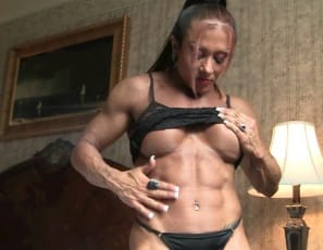 You like the sexy outfit I'm wearing for you? female bodybuilder Monica Martin asks, posing in black panties in the bedroom to show you her big, vascular biceps, powerful pecs, ripped, tattooed abs and her muscular legs,  glutes, and calves.