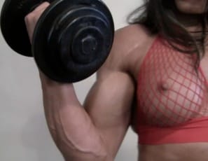 Female bodybuilder Ripped Vixen is posing in the gym, showing off her vascular biceps, her ripped, tattooed abs, and her great glutes then spreading her muscular legs as she trains on the pec deck so you can see her big clit.