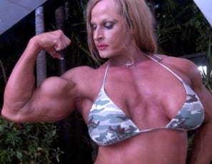 Your virtual session with ripped, tattoo female bodybuilder Nuriye has begun in the jungle, as she poses for you, showing you her muscle control of her powerful pecs, and her vascular biceps, her muscular legs and glutes and tight abs. Are you ready to play jungle games?
