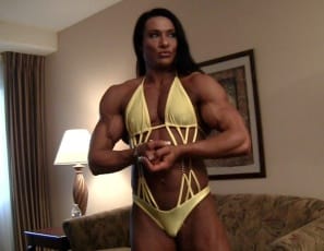 Professional female bodybuilder Alina Popa is stretching the massive muscles of her pecs, legs,  glutes,  calves,  biceps,  and abs and posing to show you how vascular and ripped she is and how good her muscle control is. Now that's a body. 