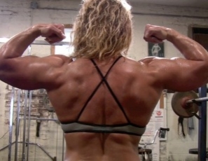 Bodybuilder Michelle Falsetta poses in the gym, stroking and massaging her powerful legs, glutes, abs and pecs and flexing her muscular biceps. Michelle is mature, but she’s stronger and sexier than ever – and that’s the truth.
