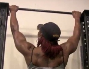 Pay close attention, bodybuilder Mistress Treasure orders, as she does topless chin-ups in the SheMuscle gym in this video, bending over to show off her gorgeous ebony glutes and legs. You know you want it, she taunts. You're just too weak to come and get it.