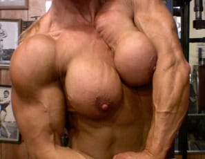 “Chest is very important,” bodybuilder Nicole Savage says, as she does bench presses and flyes in the gym, and poses to show her impressive , vascular pecs and muscle control, as well as her heavily muscled legs, biceps and abs. You might also enjoy the view of her pierced kitty as she does dumbbell presses to keep her chest the best.
